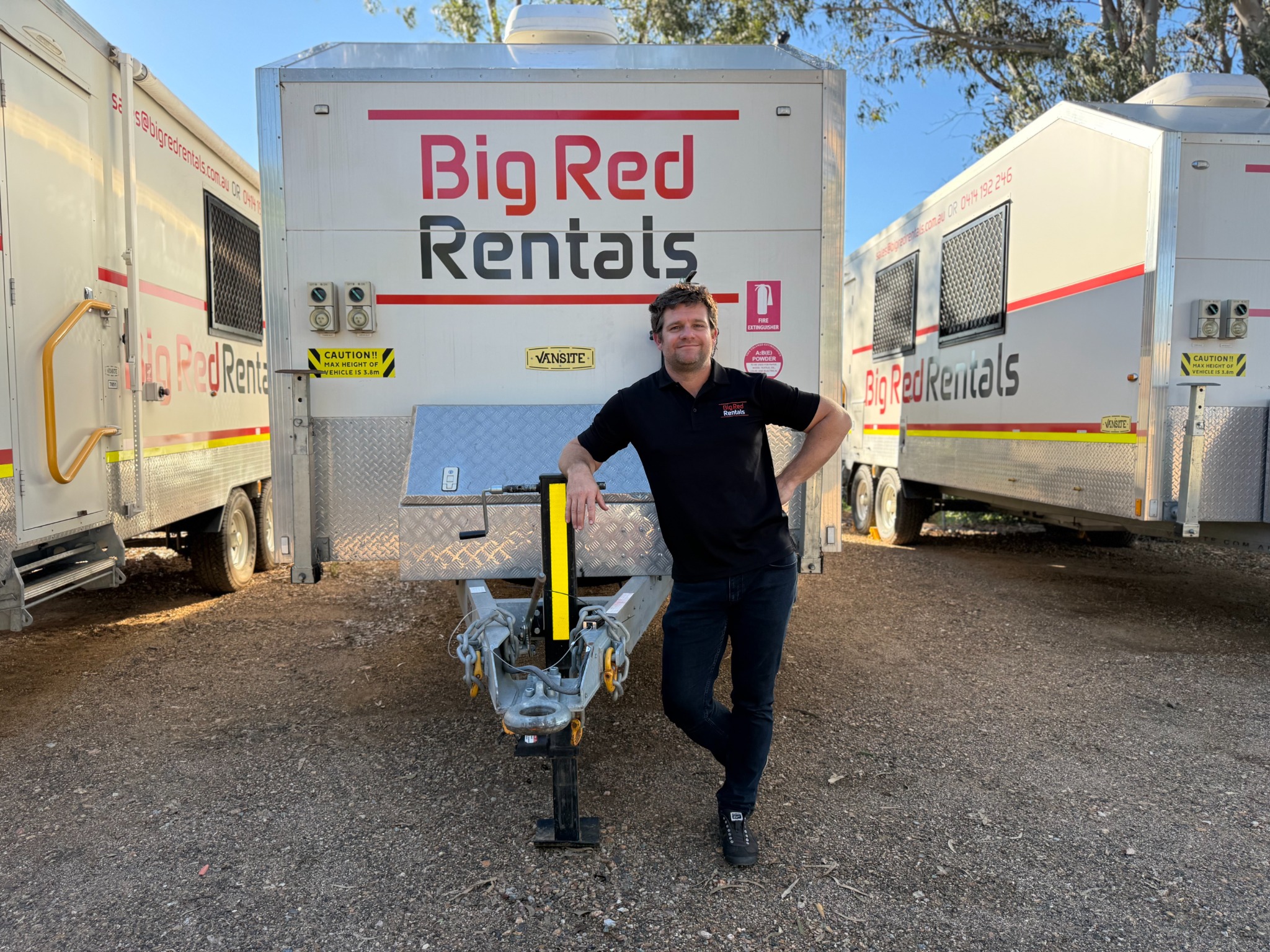 Big Red Rentals team member with mobile site vans