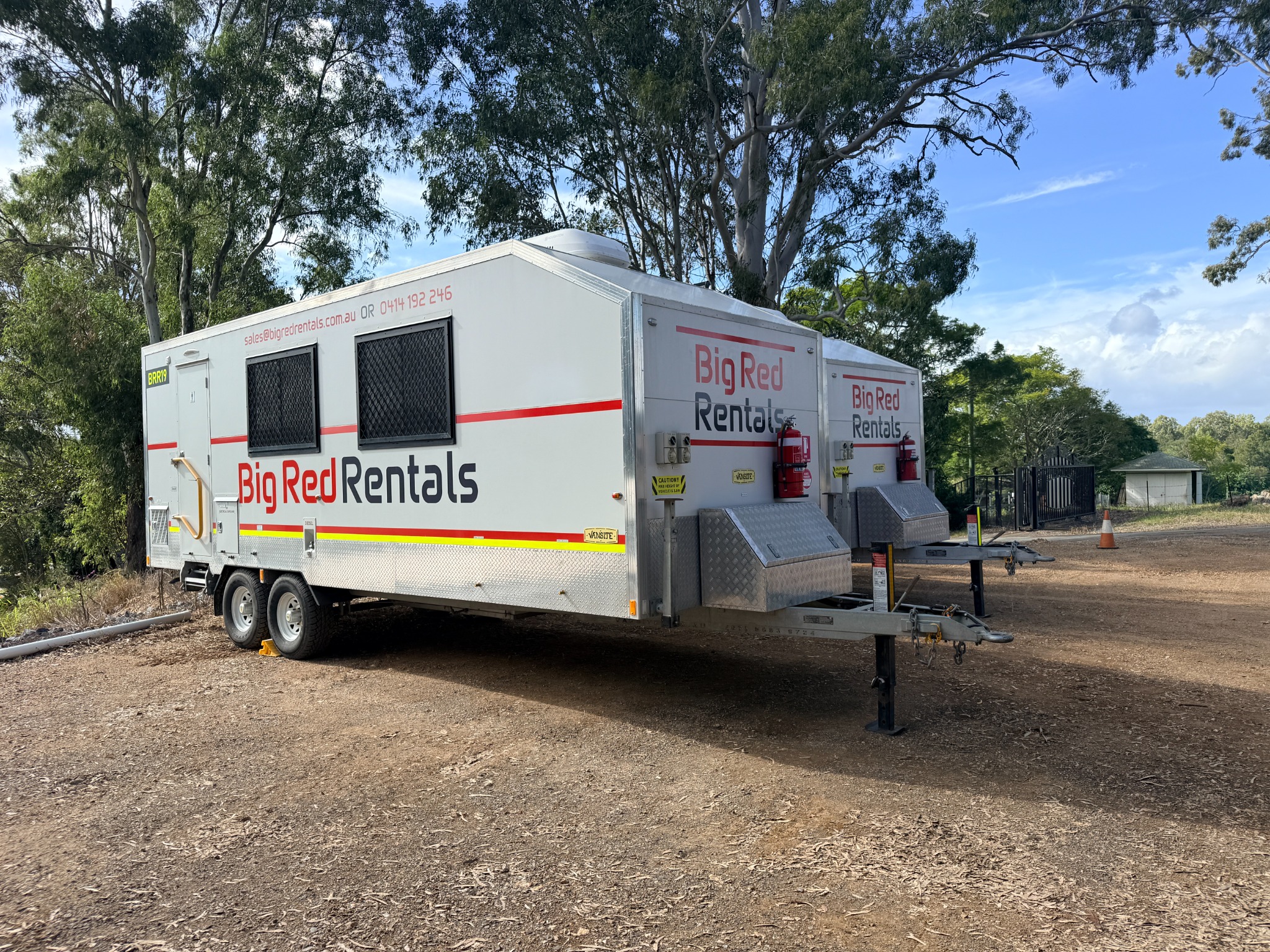 Two Big Red Rentals mobile site vans ready for hire